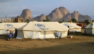 Representational file photo. People already displaced by conflict, rest by tents at a makeshift campsite they were evacuated to following deadly floods in the eastern city of Kassala on August 11, 2024. (Photo by AFP)

