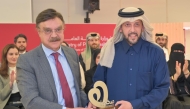 Minister of Public Health H E Mansoor bin Ebrahim Al Mahmoud (right) receiving the Sehatuha Appreciation Shield from WCM-Q Dean, Dr. Javaid Sheikh.
