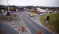 A photograph taken on March 21, 2025 shows road signs reading 