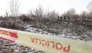 Lithuanian police search the area where a DHL cargo plane crashed near the Vilnius International Airport in Vilnius on November 25, 2024. Photo by Petras Malukas / AFP


