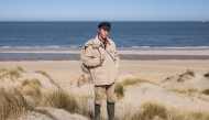 Aaron Fabrice de Kisangani poses for a picture near the beach of Calais, north of France on March 26, 2025. (Photo by Sameer Al-DOUMY / AFP)