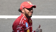 Ferrari's British driver Lewis Hamilton celebrates after winning the sprint race of the Formula One Chinese Grand Prix at the Shanghai International Circuit in Shanghai on March 22, 2025. (Photo by JADE GAO / AFP)

