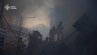 This handout photograph taken and released by the State Emergency Service of Ukraine on April 6, 2025, shows Ukrainian firefighters working on a fire following a Russian missile strike in Kyiv. (Photo by Handout / State Emergency Service of Ukraine / AFP) 