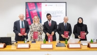 Officials pose for a group photo during the launch of legal guide on the QFC Court and Regulatory Tribunal, recently.