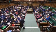 In this video grab taken from footage broadcast by the UK Parliamentary Recording Unit (PRU) via the Parliament TV website on April 12, 2025, members of parliament in the House of Commons take their seats at the start of a debate on emergency legislation to take special measures to protect the British Steel Industry. (Photo by PRU / AFP) 