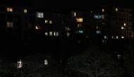 This photograph shows an apartment building of Burgos at night, partially without electricity, following a massive power cut affecting the entire Iberian peninsula and the south of France, on April 28, 2025. Photo by CESAR MANSO / AFP.
