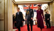 (From left) Britain's Prince George of Wales, Britain's Prince William, Prince of Wales and Britain's Catherine, Princess of Wales arrive for a tea party organised for Second World War veterans at Buckingham Palace on May 5, 2025. (Photo by Yui Mok / POOL / AFP)