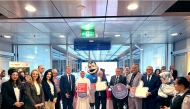 Dr. Salem Al-Naemi, President of the UDST, and other officials displaying the certification on the occasion of the UDST being recognised as Great Place to Work for the third consecutive year.