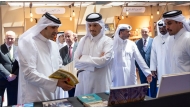 Prime Minister and Minister of Foreign Affairs H E Sheikh Mohammed bin Abdulrahman bin Jassim Al-Thani and Minister of Culture H E Sheikh Abdulrahman bin Hamad Al Thani touring the Doha International Book Fair pavilions yesterday. 