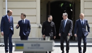 (From Left) Germany's Chancellor Friedrich Merz, France's President Emmanuel Macron, Ukraine's President Volodymyr Zelensky, Britain's Prime Minister Keir Starmer and Poland's Prime Minister Donald Tusk arrive to a press conference after their meeting in the capital Kyiv on May 10, 2025. (Photo by Genya Savilov / AFP)