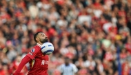 Liverpool's Egyptian striker #11 Mohamed Salah controls the ball during the English Premier League football match between Brighton and Hove Albion and Liverpool on May 19, 2025. (Photo by Glyn KIRK / AFP) 