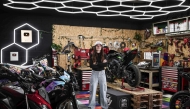 French world champion stuntwoman, Sarah Lezito, poses for portraits with her motorbikes in her garage near Epernay eastern France, on May 22, 2025. (Photo by Thibaud Moritz / AFP)
 