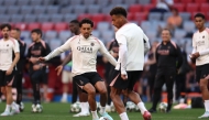 Paris Saint-Germain's Brazilian defender #5 Marquinhos (left) closes down Paris Saint-Germain's French midfielder #14 Desire Doue during the MD-1 training session on the eve of the UEFA Champions League final football match between Inter Milan and Paris Saint-Germain (PSG) in Munich, southern Germany, on May 30, 2025. (Photo by Franck Fife / AFP)