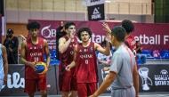 Qatar players celebrate after winning a match.