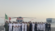 Ambassador of Italy to Qatar H E Paolo Toschi in a group photograph with the crew of the frigate.