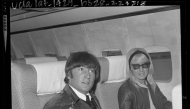 John Lennon and wife Cynthia sitting in airplane on stop over in Los Angeles, Calif., 1964. Picture: University of California, Los Angeles. Library. Department of Special Collections
