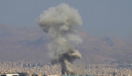 moke billows following an explosion in central Tehran on June 15, 2025. Iranian media said an Israeli strike hit the Tehran police headquarters in the city centre on June 15, as the two foes exchanged fire for a third day. (Photo by Atta KENARE / AFP)