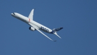 This photograph shows an Airbus A350-1000 passenger aircraft performing an exhibition flight demonstration during the 55th edition of the International Paris Air Show on June 16, 2025. (Photo by Alain Jocard / AFP)