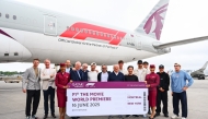 Qatar Airways crew with the F1 drivers and team principals during the trip.
