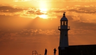 The sun rises at Mevagissey Harbour in Cornwall, Britain / Reuters file photo