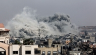 A plume of smoke billows in Jabalia in the northern Gaza Strip during an Israel strike on June 19, 2025. (Photo by Omar Al-Qattaa / AFP)
 