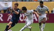 Pachuca's Argentine midfielder #18 Agustin Palavecino, Real Madrid's Spanish defender #20 Francisco Garcia and English midfielder #05 Jude Bellingham fight for the ball at the Bank of America stadium in Charlotte on June 22, 2025. (Photo by Federico Parra / AFP)
