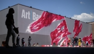 Visitors walk on the artwork 