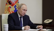 In this pool photograph distributed by the Russian state agency Sputnik, Russia's President Vladimir Putin chairs a meeting on educational and museum complexes via a videoconference at the Novo-Ogaryovo state residence outside Moscow on June 25, 2025. (Photo by Gavriil Grigorov / POOL / AFP)
