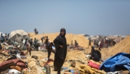 Palestinians inspect the destruction at a makeshift displacement camp following a reported incursion a day earlier by Israeli tanks in the area in Khan Yunis in the southern Gaza strip on July 11, 2025. (Photo by AFP)