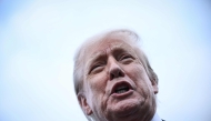 US President Donald Trump speaks to the press after disembarking from Air Force One upon his arrival at Prestwick Airport, south of Glasgow on July 25, 2025, on the first day of his UK visit. (Photo by Brendan SMIALOWSKI / AFP)
