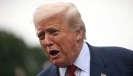 US President Donald Trump speaks to the press before boarding Marine One on the South Lawn of the White House in Washington, DC, on August 1, 2025. (Photo by Jim Watson / AFP)
