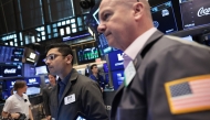 Traders work on the floor of the New York Stock Exchange during morning trading on August 05, 2025 in New York City. (Photo by Michael M. Santiago/Getty Images/AFP)
 