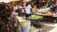 File: Sudanese people sell goods at an open market in the East Nile district of Khartoum on May 19, 2025. (Photo by Ebrahim Hamid / AFP)