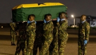 Soldiers carry a coffin of the deceased at the Air Force Base in Accra, Ghana, on Aug. 6, 2025. (The Presidency of the Republic of Ghana/Handout via Xinhua)
