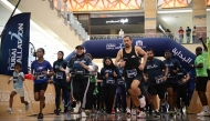 People take part in Dubai Mallathon 2025, at the City Centre Mirdif mall in Dubai on August 9, 2025. (Photo by Giuseppe Cacace / AFP)