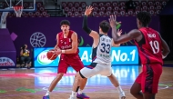 Action during the match between Qatar and South Korea on Friday. 