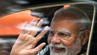 India's Prime Minister Narendra Modi waves upon his arrival to inaugurate the new Vande Bharat passenger train and Yellow Line of the Namma Metro in Bengaluru on August 10, 2025. (Photo by Idrees Mohammed / AFP)
