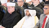 Assistant Undersecretary of the Ministry of Awqaf and Islamic Affairs, Khalid bin Shaheen Al Ghanim, and other delegates at the conference.