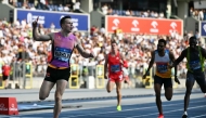 Norway's Karsten Warholm (L) celebrates as he wins the men's 400m hurdles event of the Silesia Diamond League athletics meeting in the Stadion Slaski in Chorzow, Poland, on August 16, 2025. (Photo by Sergei Gapon / AFP)
 