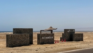(Files) A sign reads Ras Hankorab along the beach in the Red Sea Wadi Al-Gemal protectorate in southern Egypt on May 28, 2025. (Photo by Khaled Desouki / AFP)