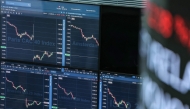 (Files) Market indicators are displayed on digital screen at the Euronext trading exchange building in La Defense business district, west of Paris, on April 7, 2025. (Photo by Thomas Samson / AFP)