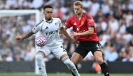 Manchester United's Dutch defender #04 Matthijs de Ligt (R) vies with Fulham's Brazilian striker #09 Rodrigo Muniz at Craven Cottage in London on August 24, 2025. (Photo by Justin Tallis / AFP)