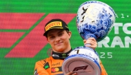 Winner McLaren's Australian driver Oscar Piastri celebrates on the podium following the Formula One Dutch Grand Prix at The Circuit Zandvoort, western Netherlands, on August 31, 2025. (Photo by John Thys / AFP)