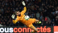 (FILES) Paris Saint-Germain's Italian goalkeeper #99 Gianluigi Donnarumma makes a save during the French L1 football match between Paris Saint-Germain (PSG) and Olympique Lyonnais (Lyon) at the Parc des Princes stadium in Paris on April 21, 2024. (Photo by Franck FIFE / AFP)
