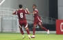 Mohamed Siraj (right) celebrates with a teammate after scoring Qatar's fourth goal.