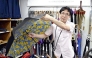 Hirofumi Kawaguchi shows a Silent Umbrella at Maruyasu Yougasa in Abeno Ward, Osaka. Pic: The Japan News
 