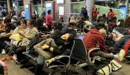 Passengers wait to board a Southwest flight in Dallas on Dec. 25, 2022, after the flight was delayed six hours because of a shortfall of flight attendants. The flight was then canceled. Photo credit: John McDonnell/The Washington Post
