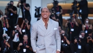 Dwayne Johnson poses at the red carpet before the premiere of the film 