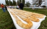 Seven rows of strudel on a table, during an attempt to set a Guinness World Record for the largest strudel in the world, in the village of Jeskovo near Karlovac, on September 6, 2025. Photo by DAMIR SENCAR / AFP