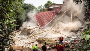Rescue teams pull down unstable remains of a community Islamic study hall building with ropes after it collapsed while female Muslims were conducting studies in Bogor, West Java, on September 7, 2025. Photo by ADITYA AJI / AFP